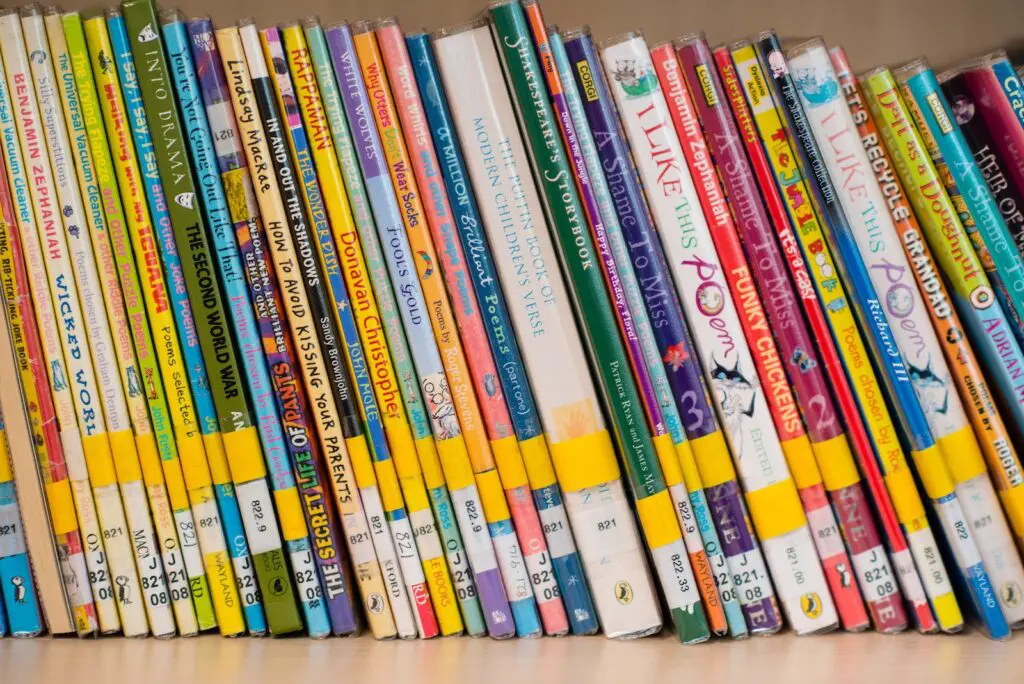 Close-up of a shelf densely packed with colorful children's poetry and joke books.