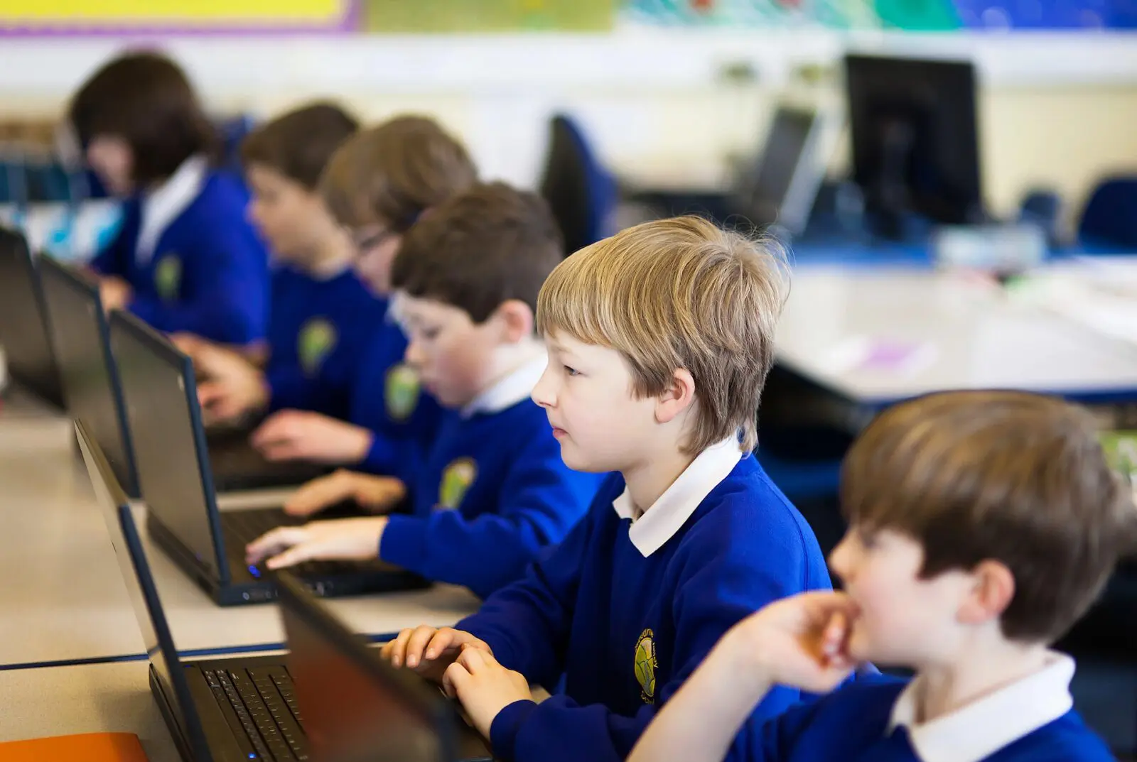 Students using laptops in a classroom