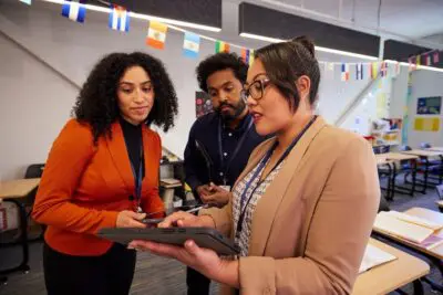 Teachers looking at a tablet